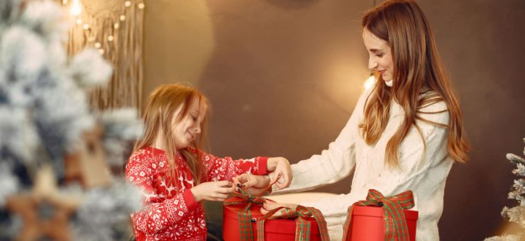https://www.pexels.com/photo/mother-and-daughter-unwrapping-christmas-gifts-5888544/